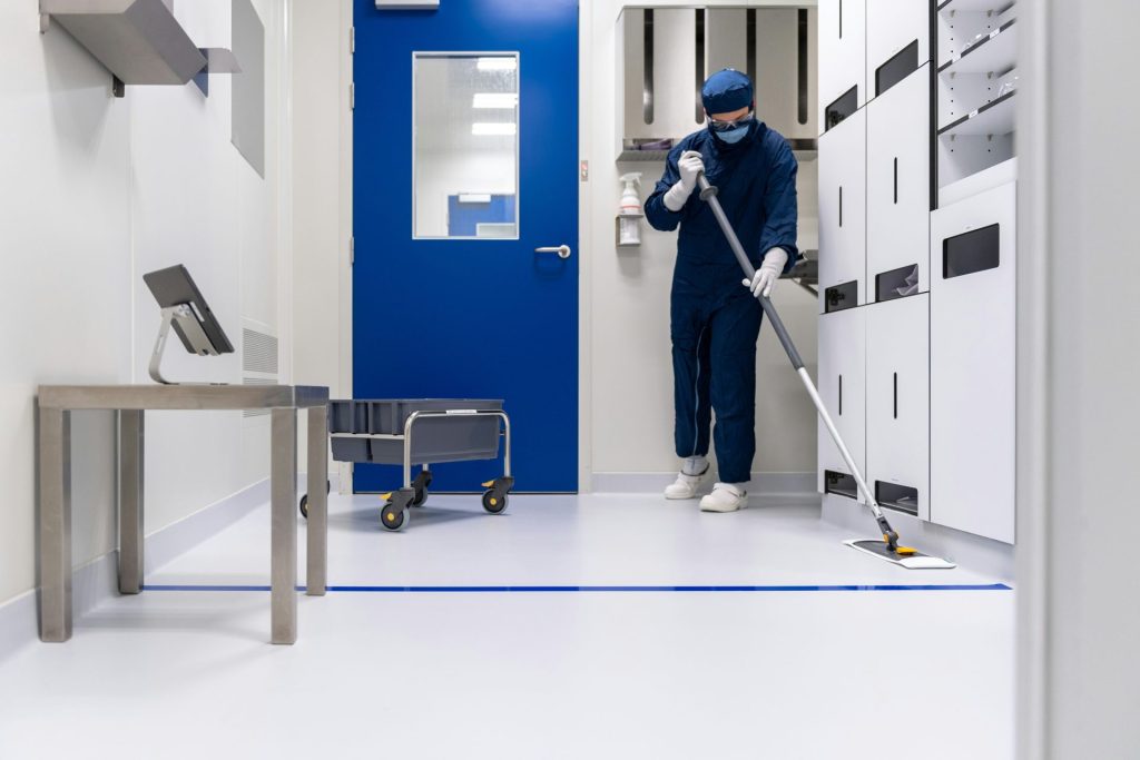 a person in a blue mask and a mask holding a ladder